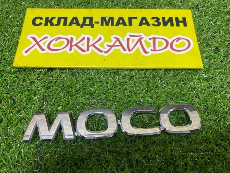 Эмблема Nissan Moco MG22S K6A 2010 задняя