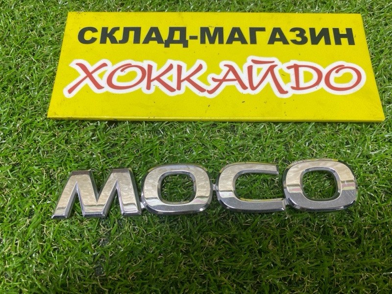 Эмблема Nissan Moco MG22S K6A 2010 задняя