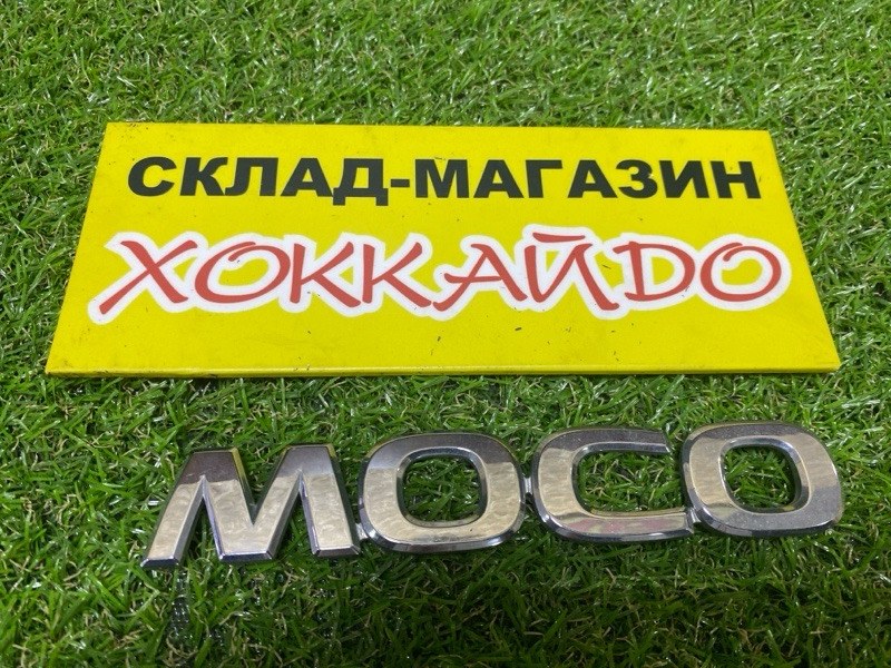 Эмблема Nissan Moco MG22S K6A 2010 задняя