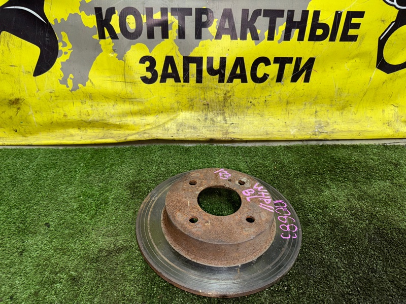 Диск тормозной Nissan Primera WHP11 SR20DE 09.1997 задний (б/у)