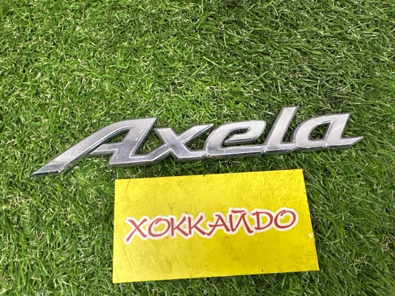 Эмблема Mazda Axela BKEP LF-DE 10.2003 задняя (б/у)