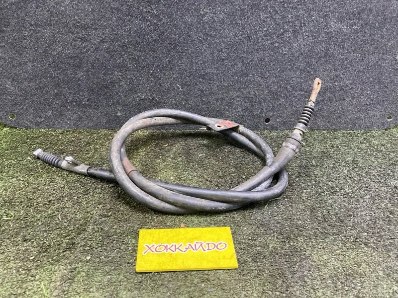 Трос ручника Nissan Rasheen RHNB14 SR18DE 12.1994 задний левый (б/у)