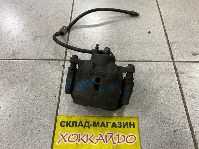 Суппорт Toyota Ist NCP60 2NZ-FE 05.2002 передний правый (б/у)