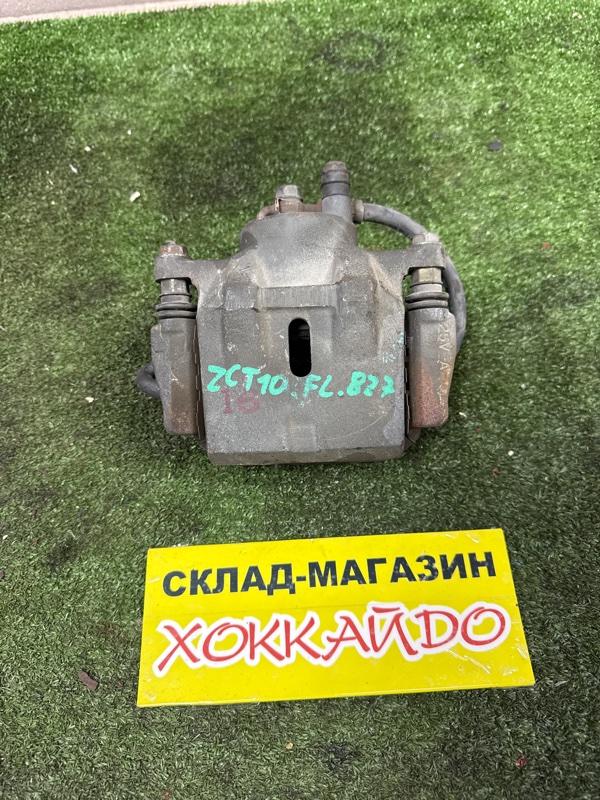 Суппорт Toyota Opa ZCT10 1ZZ-FE 06.2002 передний левый (б/у)