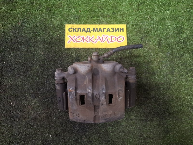 Суппорт Nissan Serena RC24 QR25DE 12.2001 передний левый (б/у)