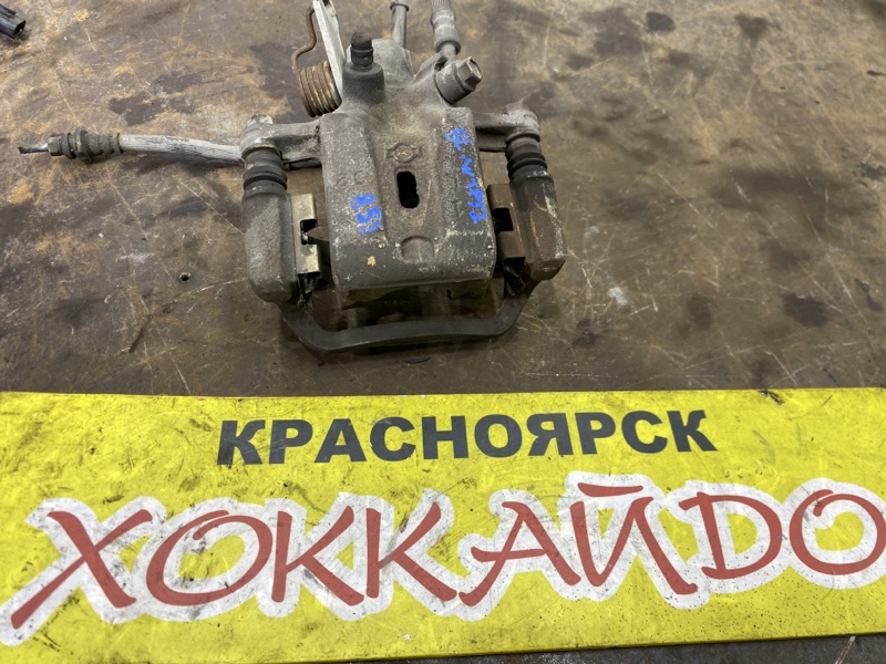 Суппорт Nissan Primera WTP12 QR20DE 07.2003 задний левый (б/у)