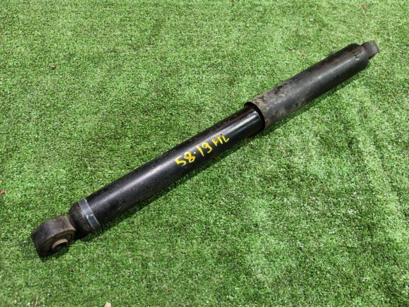 Амортизатор Daihatsu Boon M310S 1KR-FE 2007 задний левый (б/у)