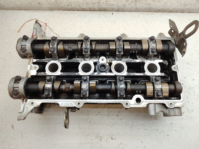 Головка блока цилиндров Mazda Familia BJ3P FPDE (б/у) Головка блока цилиндров Mazda Familia BJ3P FPDE (б/у)