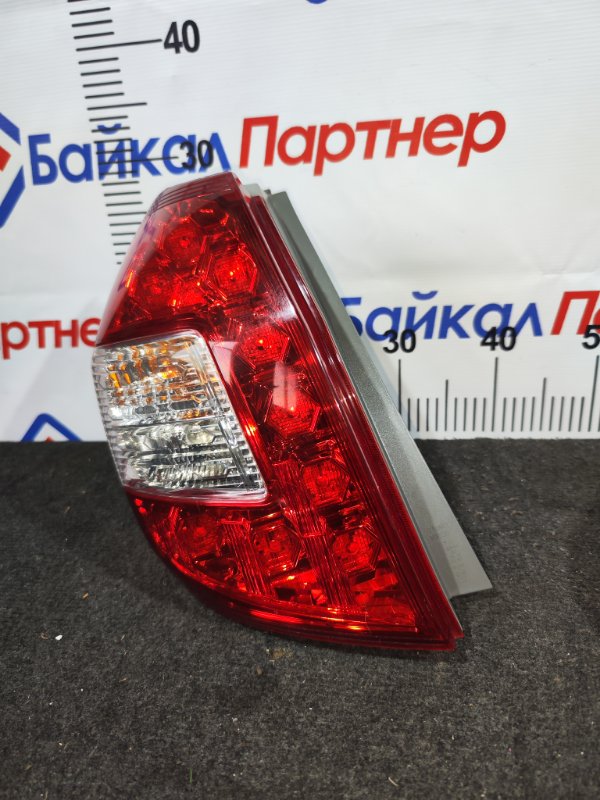 Стоп HONDA FIT SHUTTLE GG7 L15A 2011 задний левый W0020 (б/у)