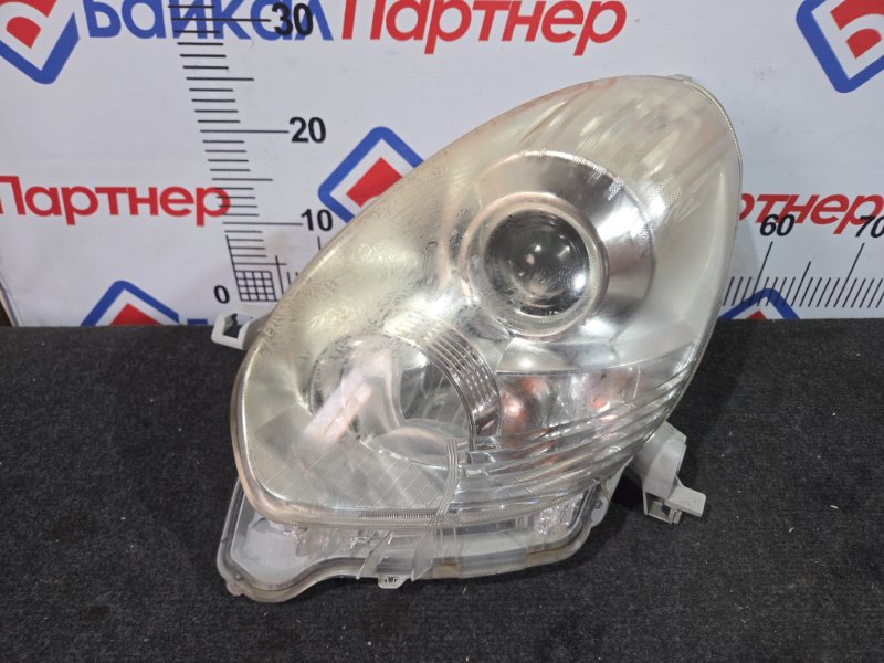 Фара TOYOTA PASSO KGC35 1KR-FE передняя левая 100-51007 (б/у)