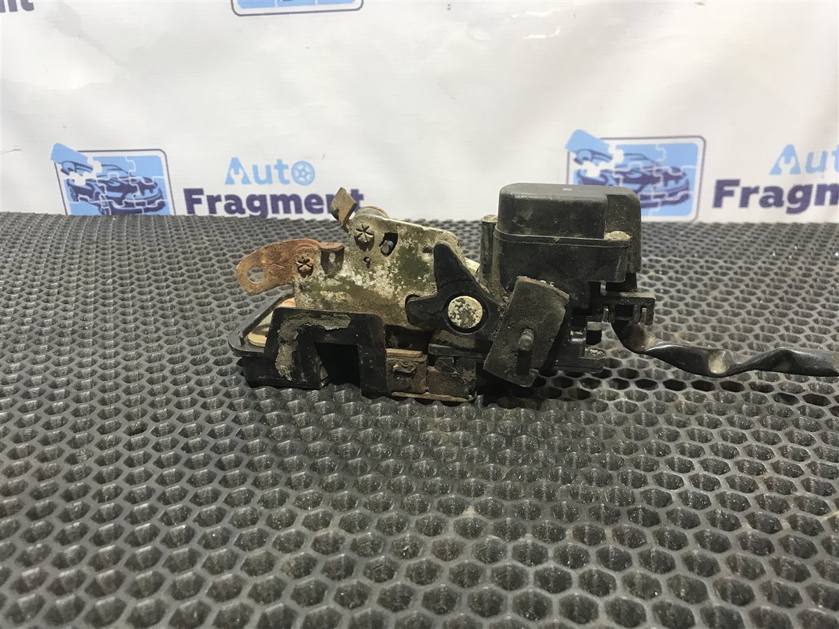 Замок двери задний левый 626 1992 FS 2.0