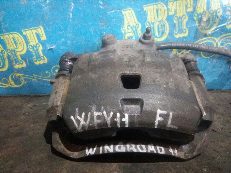 Суппорт Nissan Wingroad WFY11 передний левый