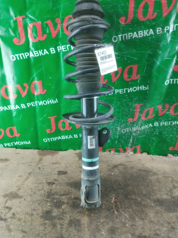 Стойка Toyota Ractis NCP100 1NZ-FE 2009 передняя левая (б/у) 2WD