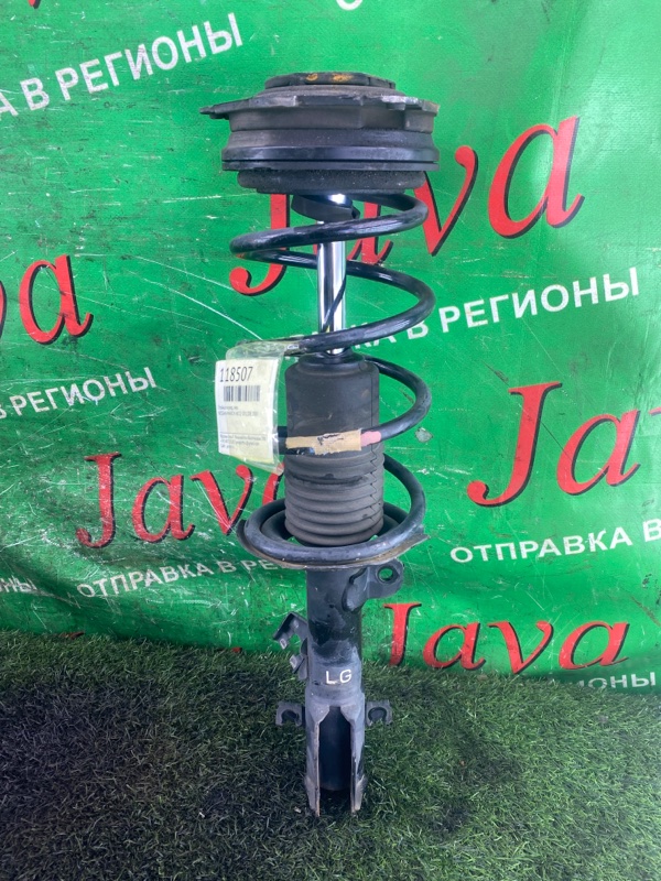 Стойка Nissan March AK12 CR12DE 2007 передняя левая (б/у) 2WD. ДЕФЕКТ ПЫЛЬНИКА. РЖАВАЯ ГАЙКА.