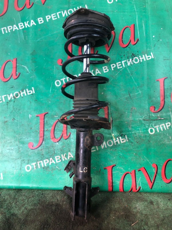 Стойка Nissan March AK12 CR12DE 2010 передняя левая (б/у) 2WD. ДЕФЕКТ ПЫЛЬНИКА. РЖАВАЯ ГАЙКА.