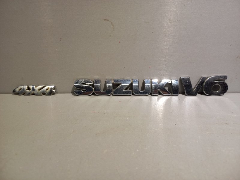 Эмблема Suzuki Grand Vitara Xl7 H27A 2001 (б/у)