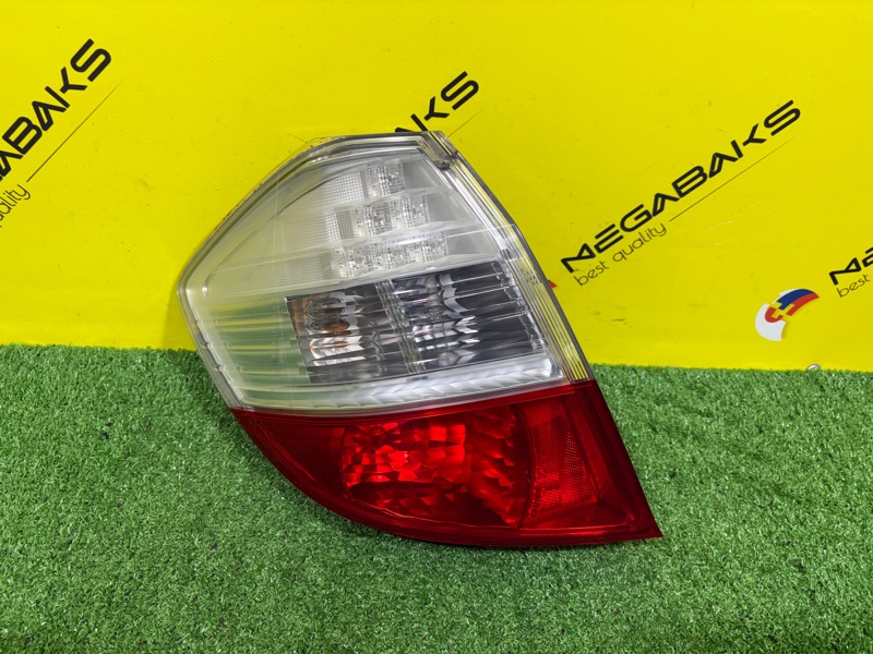 Стоп-сигнал HONDA FIT GE8 L15A 2010 левый P7612 (б/у)