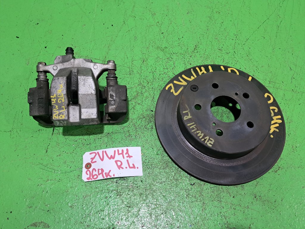 Суппорт TOYOTA PRIUS ALPHA ZVW41 задний левый (б/у)