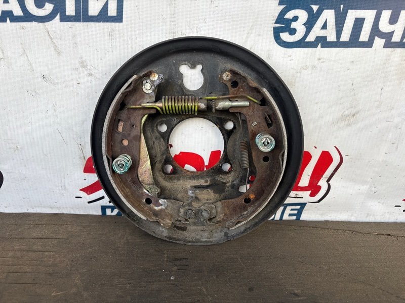Механизм стояночного тормоза Toyota Porte NNP11 1NZ-FE задний правый (б/у)