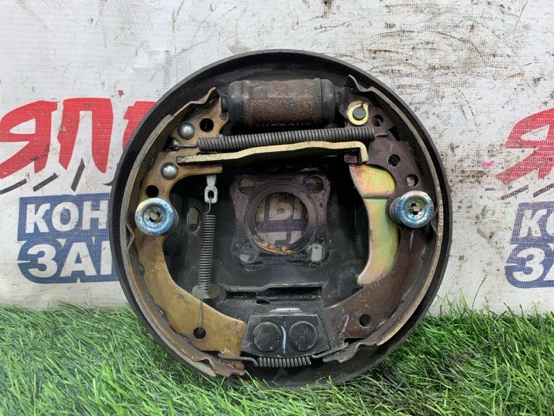 Механизм стояночного тормоза Nissan March AK12 CR12DE задний левый (б/у)