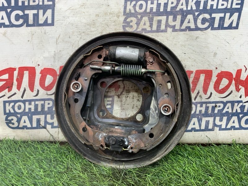 Механизм стояночного тормоза TOYOTA VITZ KSP90 1KR-FE задний левый (б/у)