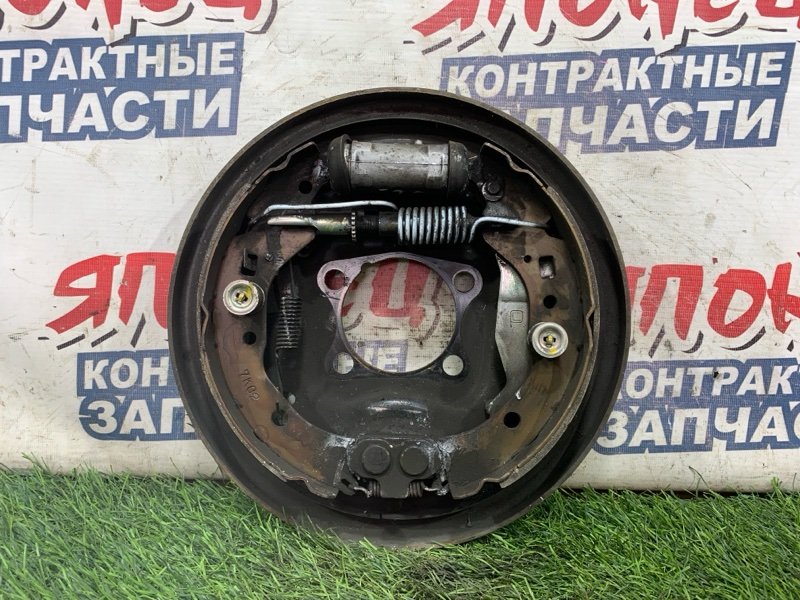 Механизм стояночного тормоза TOYOTA RACTIS NCP100 1NZ-FE задний левый (б/у)