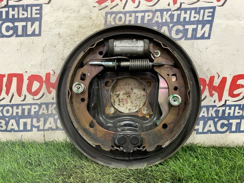 Механизм стояночного тормоза TOYOTA RACTIS NCP125 1NZ-FE задний левый (б/у)