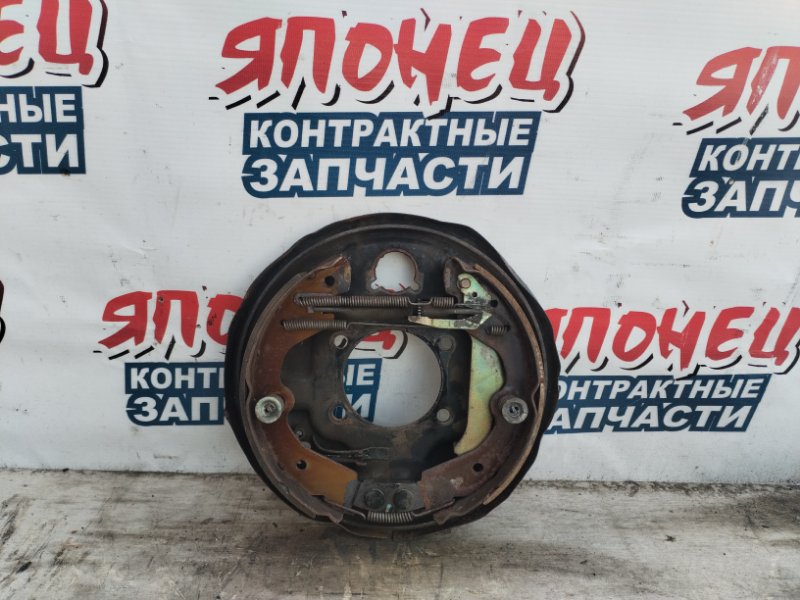 Механизм стояночного тормоза NISSAN MARCH BNK12 CR14DE задний левый (б/у)