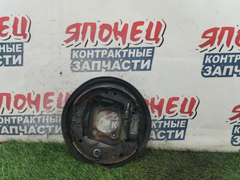 Механизм стояночного тормоза TOYOTA FUNCARGO NCP20 2NZ-FE задний левый (б/у)