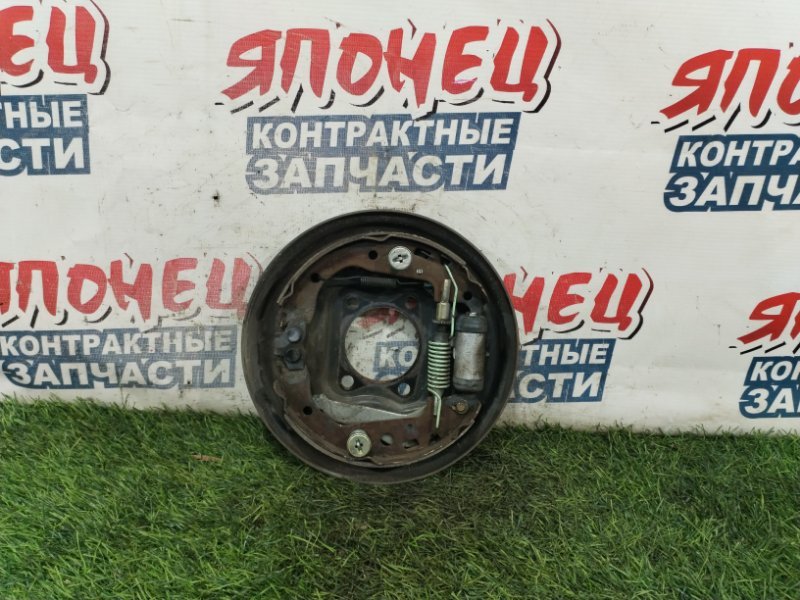 Механизм стояночного тормоза TOYOTA FUNCARGO NCP21 1NZ-FE задний левый (б/у)