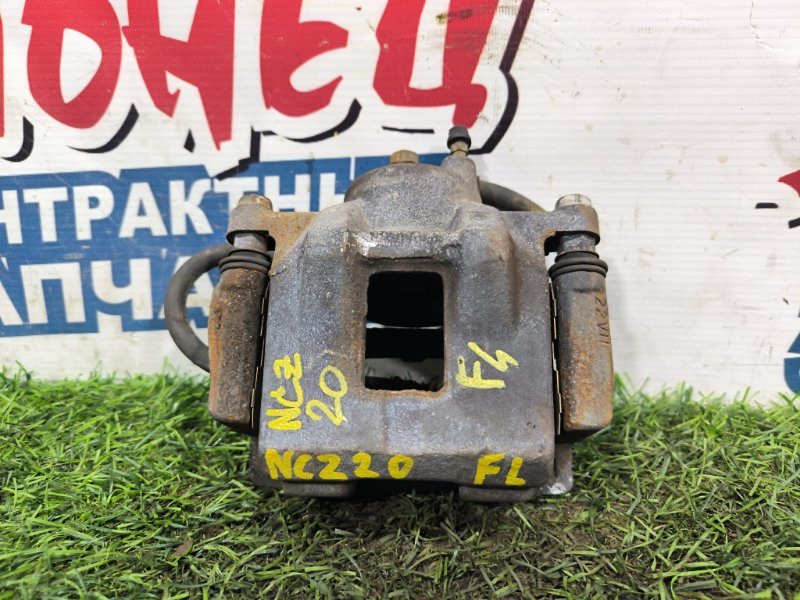 Суппорт TOYOTA RAUM NCZ20 1NZ-FE передний левый (б/у) Суппорт TOYOTA RAUM NCZ20 1NZ-FE передний левый (б/у)