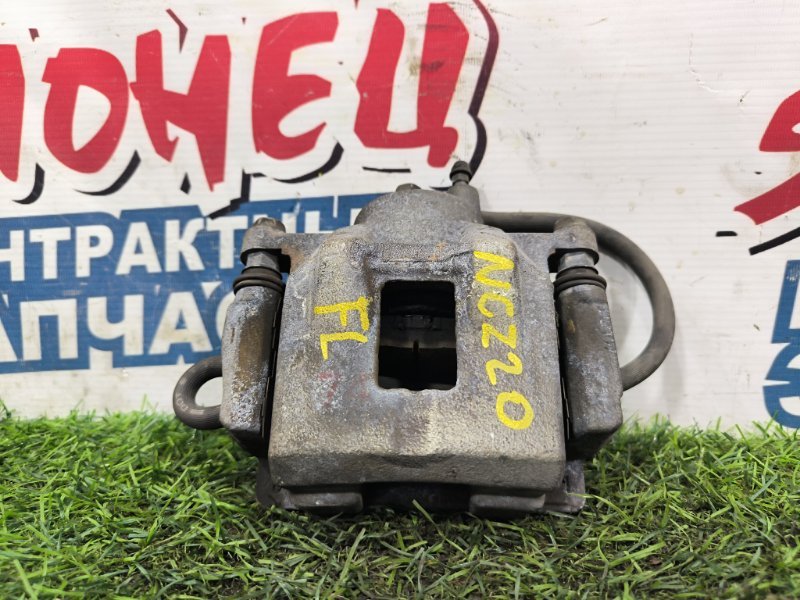 Суппорт TOYOTA RAUM NCZ20 1NZ-FE передний левый (б/у) Суппорт TOYOTA RAUM NCZ20 1NZ-FE передний левый (б/у)