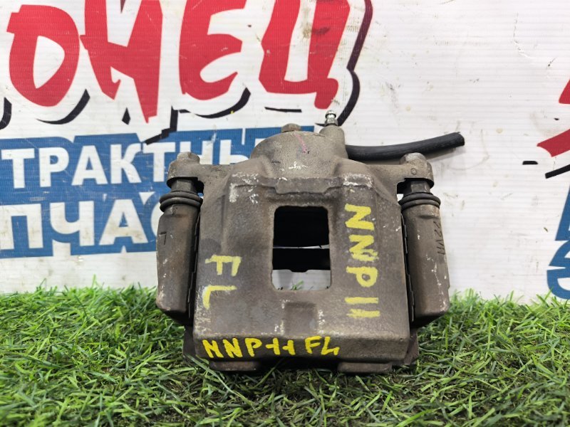 Суппорт TOYOTA PORTE NNP11 1NZ-FE передний левый (б/у) Суппорт TOYOTA PORTE NNP11 1NZ-FE передний левый (б/у)