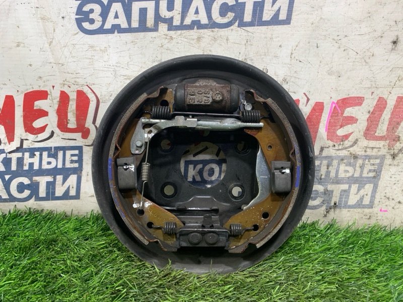 Механизм стояночного тормоза HONDA FIT ARIA GD8 L15A задний левый (б/у)