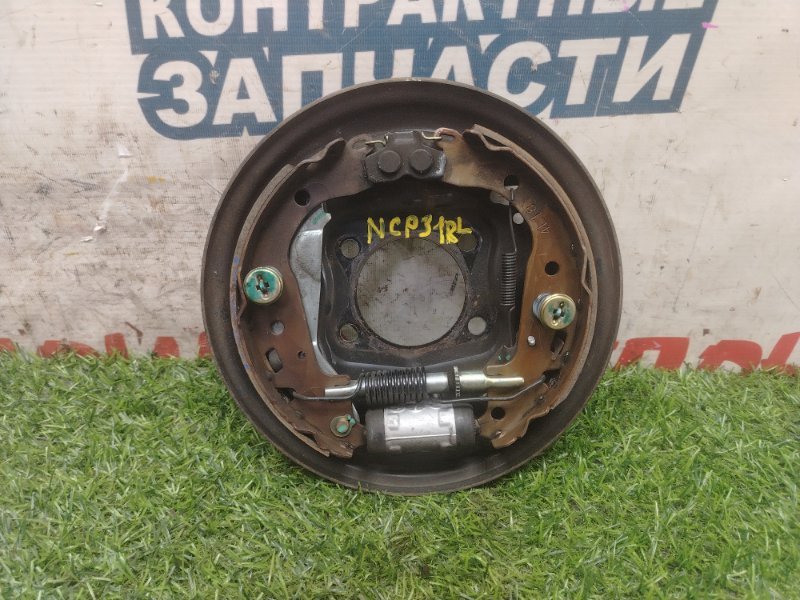 Механизм стояночного тормоза TOYOTA BB NCP31 1NZ-FE задний левый (б/у)