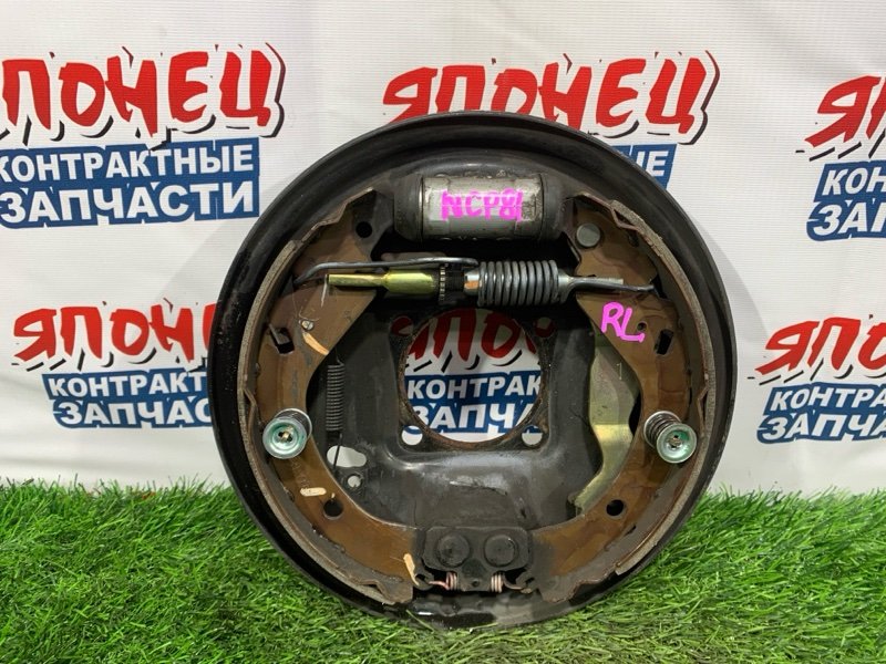 Механизм стояночного тормоза TOYOTA SIENTA NCP81 1NZ-FE задний левый (б/у)