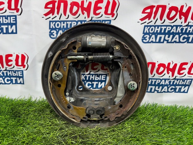 Механизм стояночного тормоза TOYOTA BB NCP31 1NZ-FE задний левый (б/у)