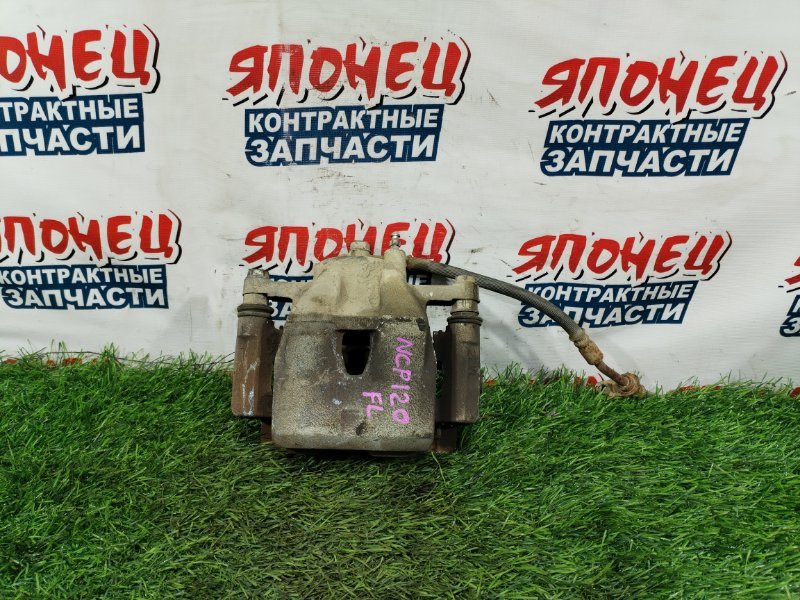 Суппорт TOYOTA RACTIS NCP120 1NZ-FE передний левый (б/у)