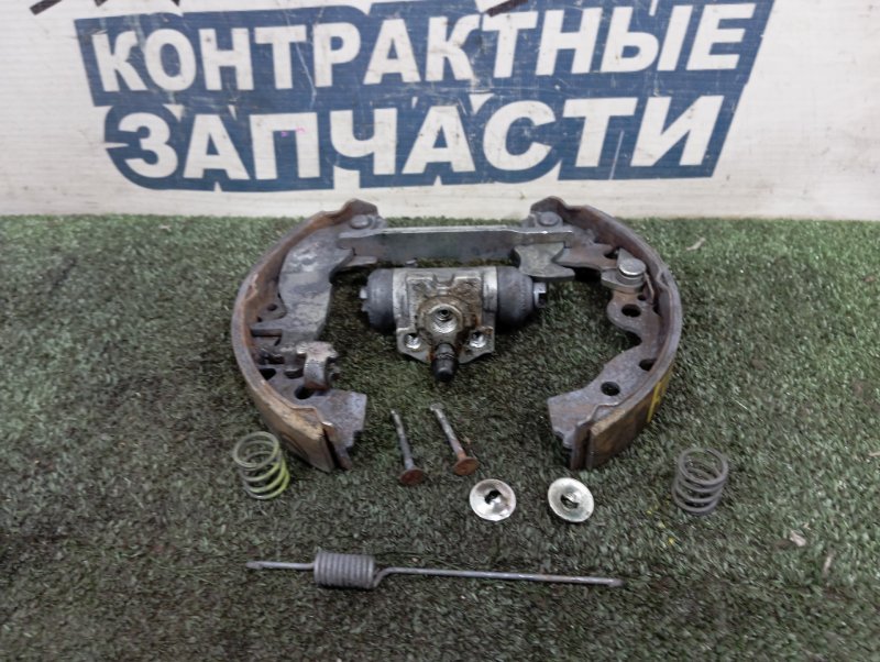 Механизм стояночного тормоза TOYOTA PASSO KGC30 1KR-FE задний левый (б/у)