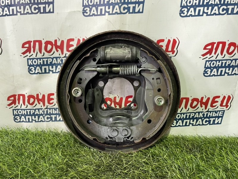 Механизм стояночного тормоза TOYOTA SPADE NCP145 1NZ-FE задний левый (б/у)