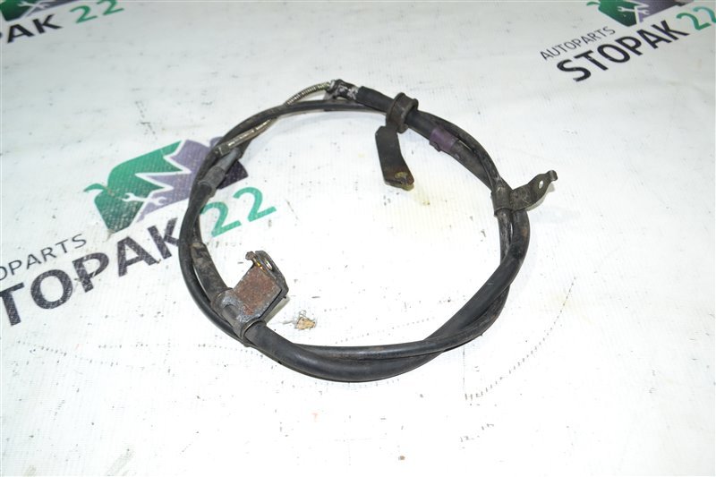 Трос ручника Toyota Corolla NZE124 1NZ 2001 задний правый (б/у)