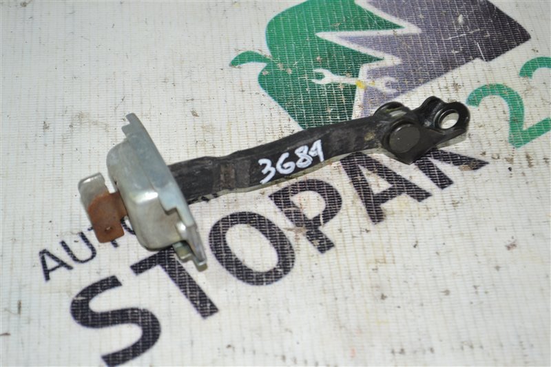 Ограничитель двери Toyota Corolla NZE124 2002 передний (б/у)