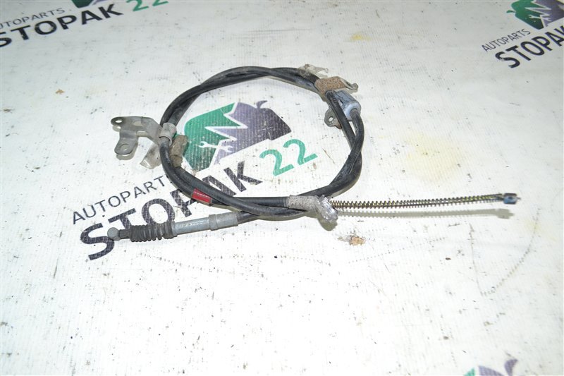 Трос ручника Toyota Corolla NZE121 1NZ 2001 задний левый (б/у)