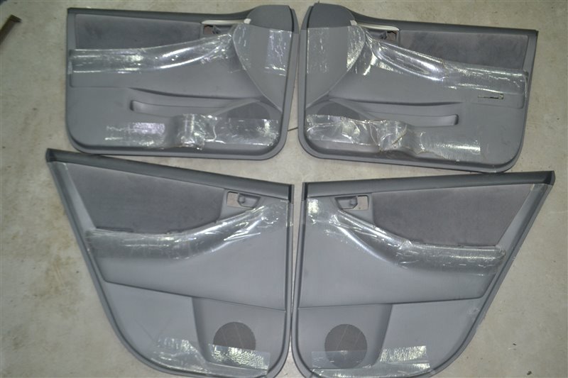 Обшивка дверей (Комплект) Toyota Corolla NZE124 1NZ 2005 (б/у)