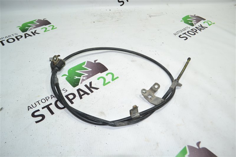 Трос ручника Toyota Corolla NZE121 1NZ 2004 задний левый (б/у) Трос ручника Toyota Corolla NZE121 1NZ 2004 задний левый (б/у)