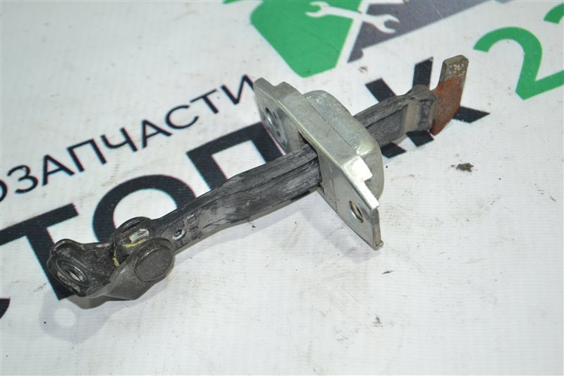 Ограничитель двери Toyota Corolla Runx NZE121 1NZ 2005 передний (б/у)