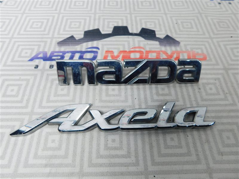 Эмблема Mazda Axela BL3FW задняя