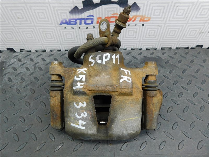 Суппорт Toyota Platz SCP11-0080380 1SZ-FE 2005 передний правый