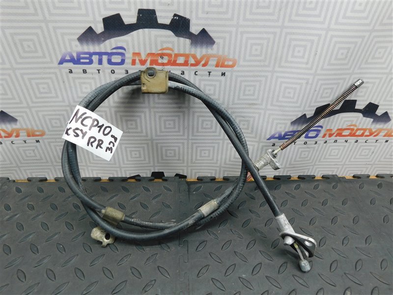 Тросик ручника TOYOTA VITZ NCP10-0157699 2NZ-FE 2002 задний правый (б/у)