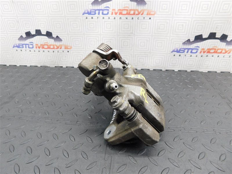 Суппорт HONDA CIVIC FD1 R18A задний левый (б/у) Суппорт HONDA CIVIC FD1 R18A задний левый (б/у)